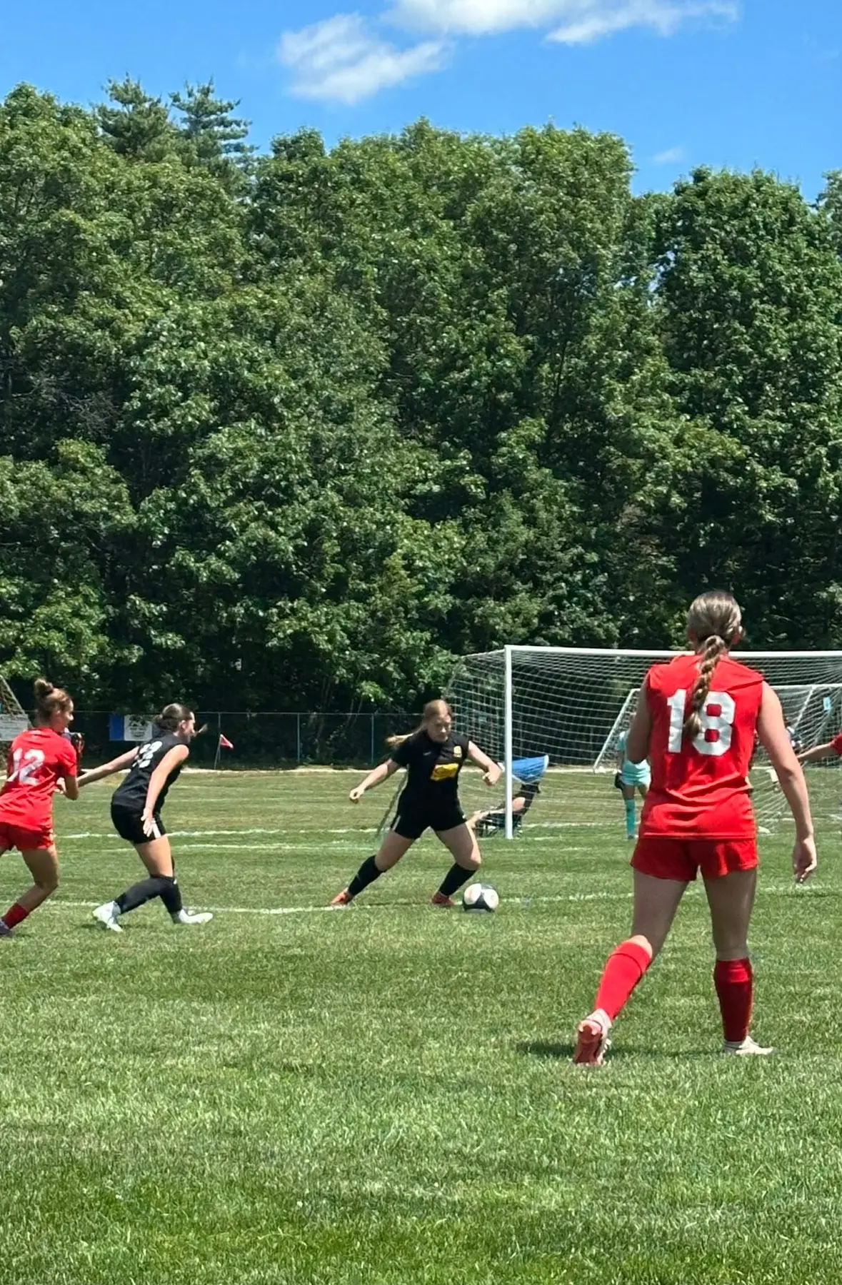 Izabel Barmosz receiving the ball and preparing to play forward